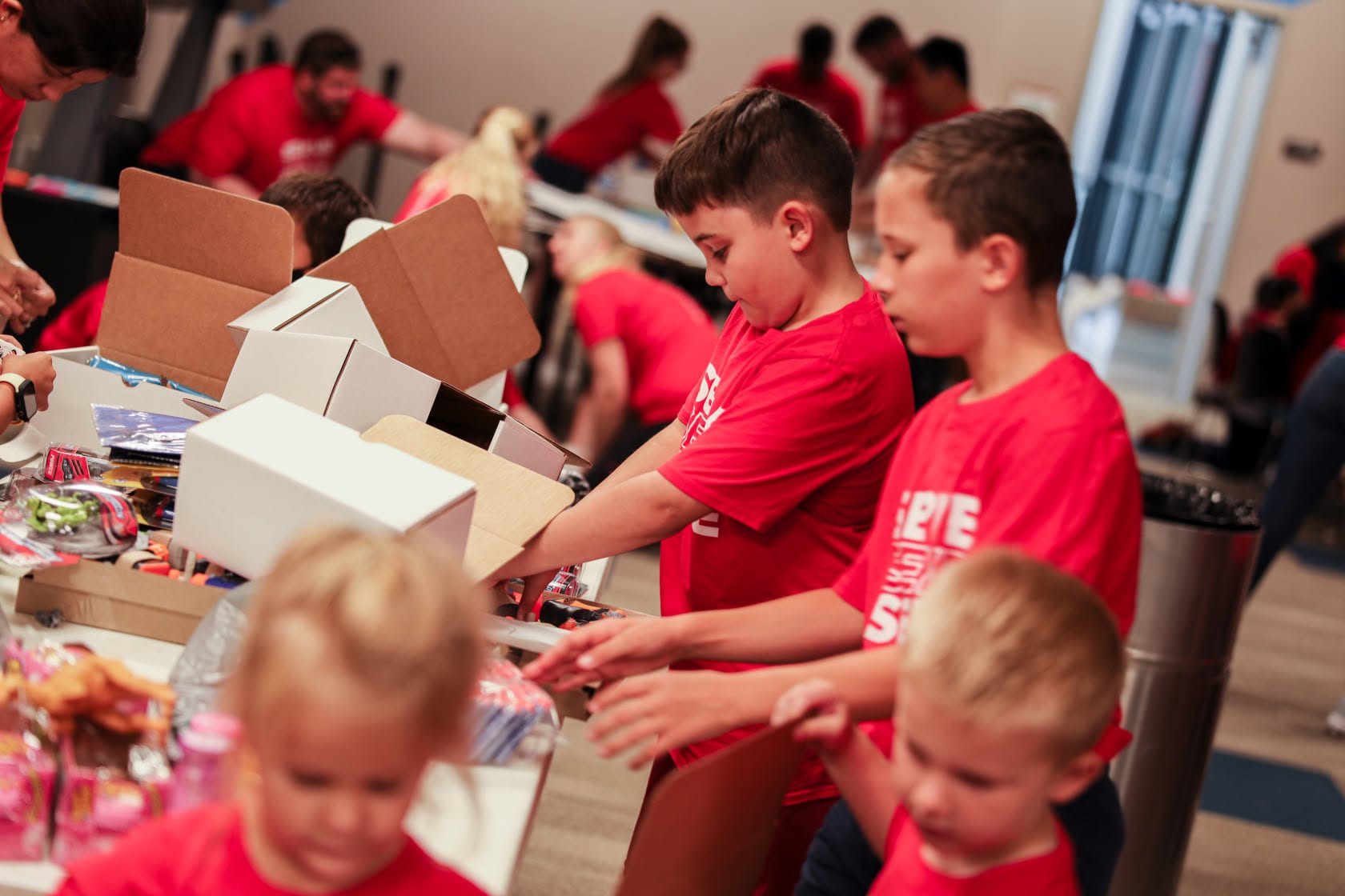 Volunteers packing donation boxes